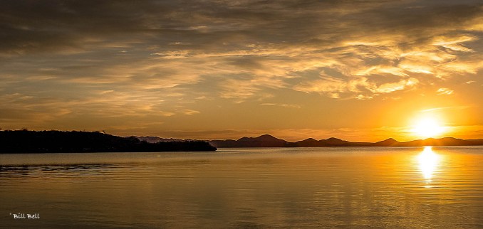 As the sun sets over Bahia Conception, the sky transforms into a canvas of golden hues, reflecting on the tranquil waters and creating a perfect ending to a day of adventure.