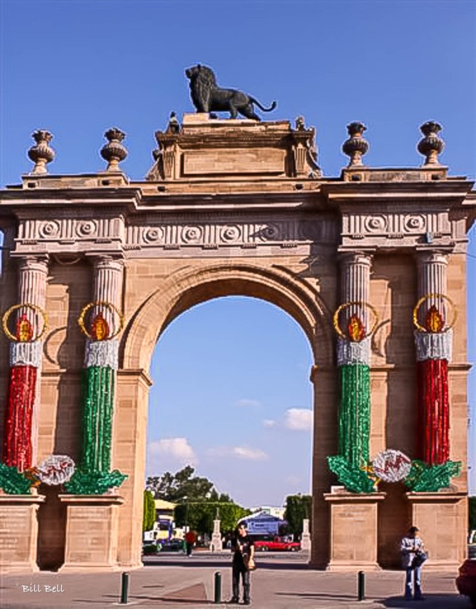 The iconic Arch of León, crowned with a majestic lion statue, serves as a symbol of the city and a gateway to its historical and cultural treasures.