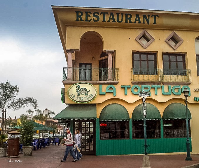 La Tortuga Restaurant, a popular dining spot in Ensenada, known for its delicious local cuisine and inviting atmosphere. The restaurant's terrace offers a perfect setting for enjoying a meal while taking in the coastal views. La Tortuga is a great place to experience authentic Baja Californian flavors.