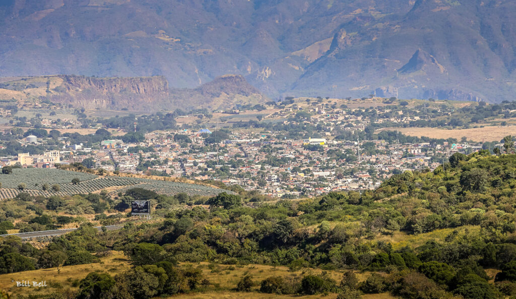  The town of Tequila nestled in the valley, surrounded by agave fields and mountains—a blend of natural beauty and cultural heritage.