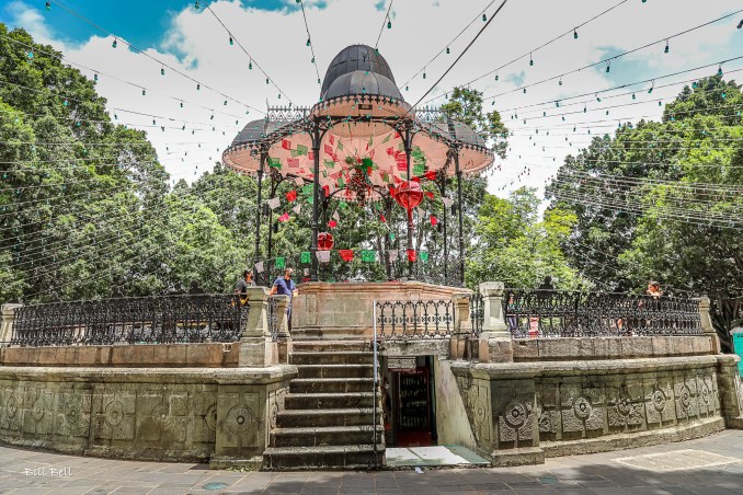 Zócalo Bandstand in Oaxaca: A vibrant centerpiece in the heart of Oaxaca’s Zócalo, adorned with colorful lights and decorations in preparation for the Guelaguetza festival.