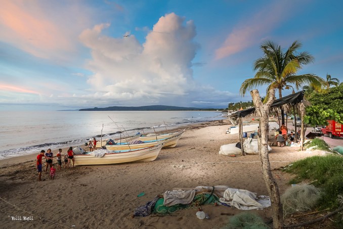 A serene view of the coastline at La Peñita de Jaltemba, where the tranquil waters meet the golden sandy beach, offering a peaceful retreat from the hustle and bustle.