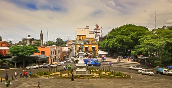 A panoramic view of Cuernavaca's city center, with its colonial-era buildings and modern-day traffic, reflecting the dynamic blend of old and new in this historic city.