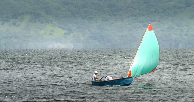 Boating on Lake Catemaco:A serene scene of fishermen sailing on Lake Catemaco, capturing the tranquility and natural beauty of this volcanic crater lake. (Photo by Bill Bell)