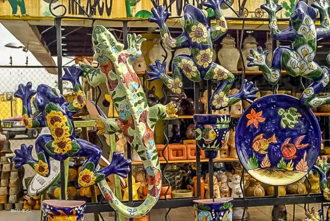 A vibrant display of Talavera pottery geckos captures the eye at a Dolores Hidalgo shop, showcasing the town's renowned ceramic artistry and vibrant colors.