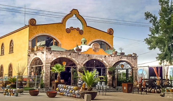 A charming artisan shop in Dolores Hidalgo displays a variety of handcrafted Talavera pottery and ceramics, reflecting the town's artistic and cultural identity.