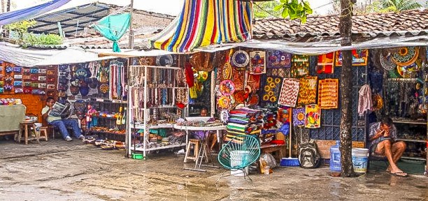 A local artisan market in Zihuatanejo, where visitors can browse and purchase handmade crafts, traditional Mexican textiles, and unique souvenirs to take home.