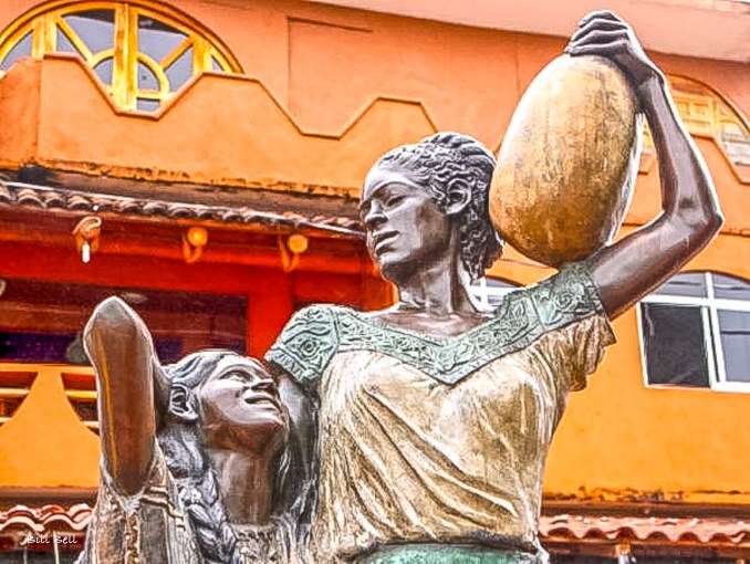 A vibrant sculpture in Zihuatanejo's town center celebrating the strength and resilience of local women, symbolizing the town's cultural pride and community spirit.