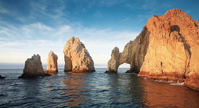 The iconic El Arco de Cabo San Lucas, where the Pacific Ocean meets the Sea of Cortez, is a stunning natural rock formation and a symbol of Cabo