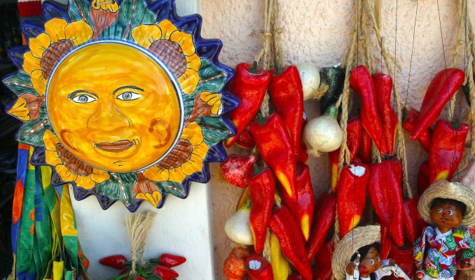 A vibrant display of colorful Mexican crafts and souvenirs, reflecting the rich cultural heritage of Cabo San Lucas