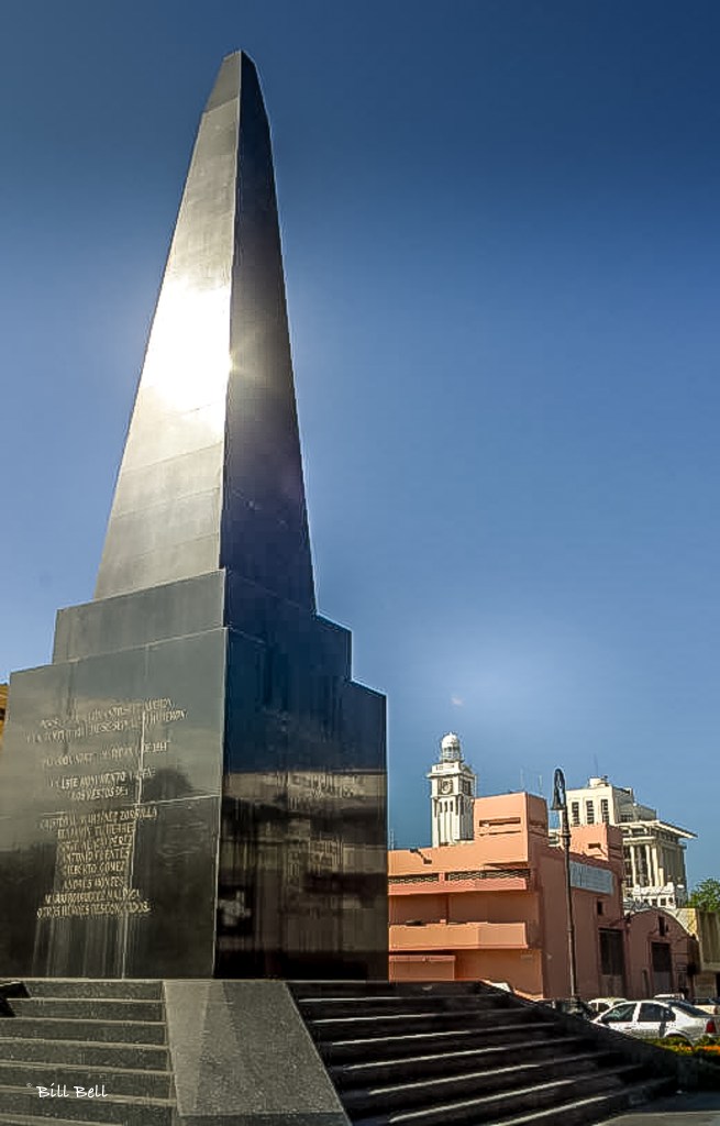 A towering obelisk monument stands in the heart of Veracruz, commemorating the city's heroic defense during multiple invasions, including conflicts with France and the United States. This monument is a symbol of Veracruz's resilience and rich history. © Bill Bell